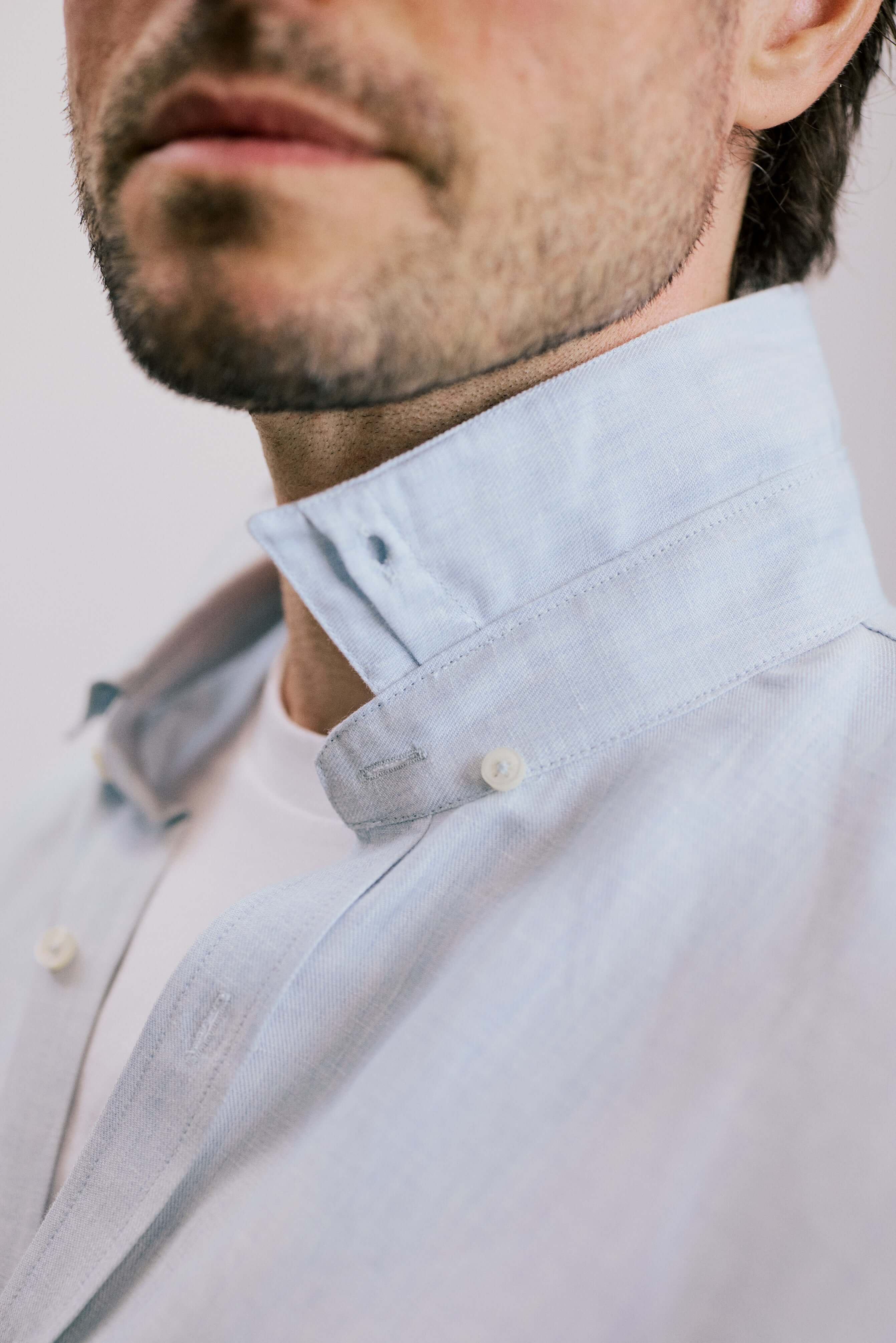 Close-up of a man wearing the VARRO Evelyn Mist Blue shirt with a hidden button-down collar and relaxed fit.