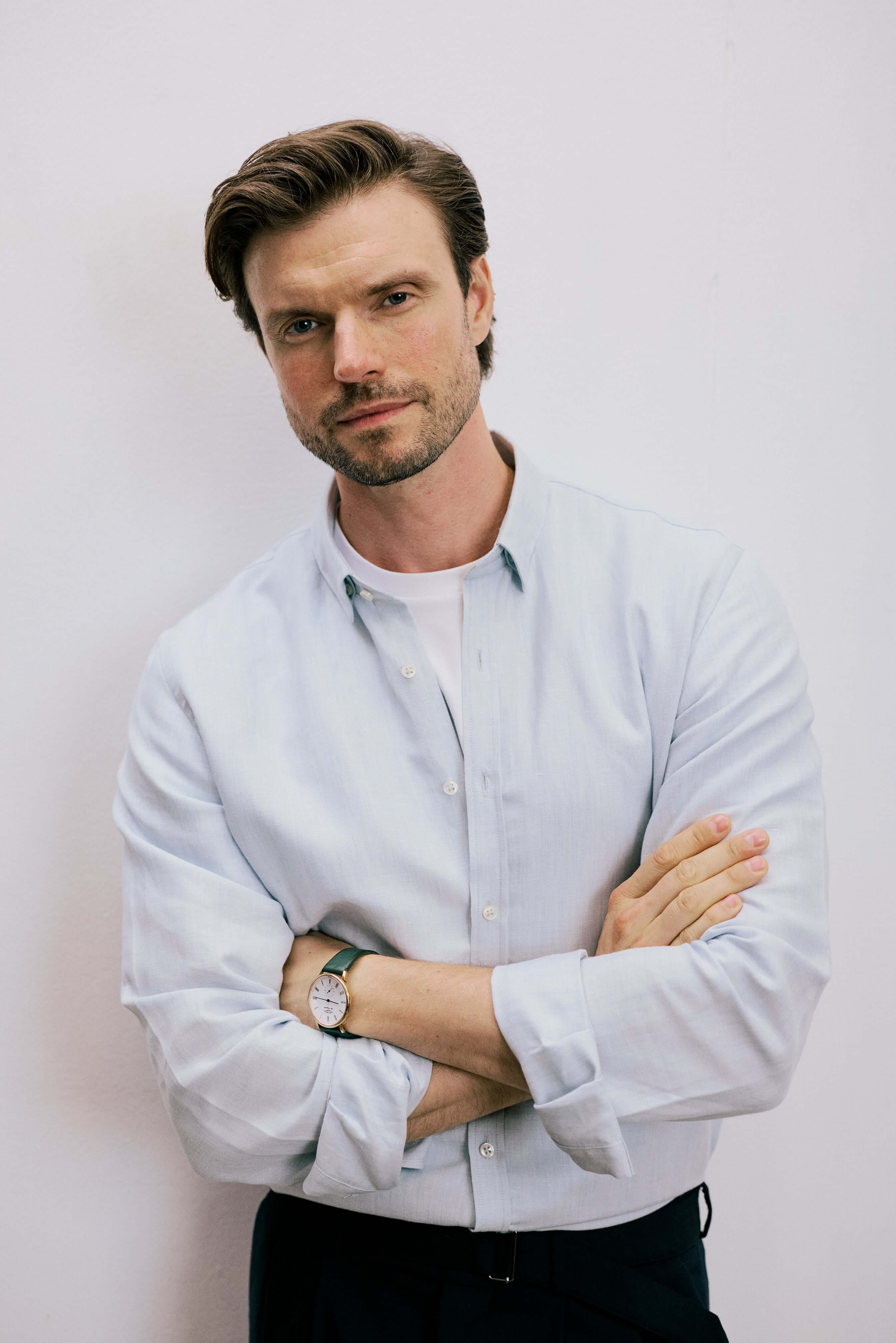 VARRO Evelyn Mist Blue shirt on model in relaxed fit, featuring hidden button-down collar and long sleeves.