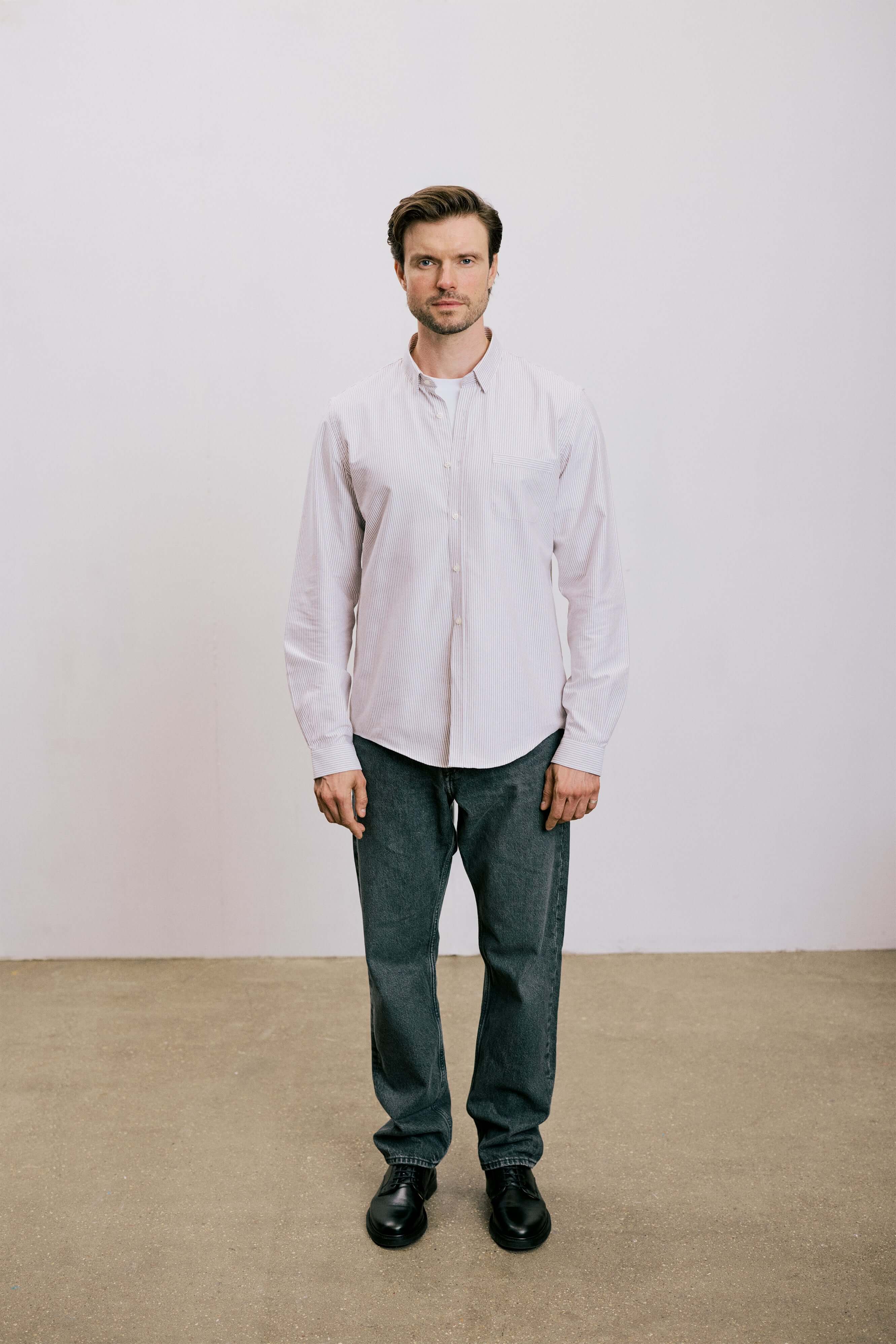 VARRO Keble Blue Stripe Oxford Shirt — Front view of man wearing long sleeve shirt with hidden button-down collar, smart casual style.