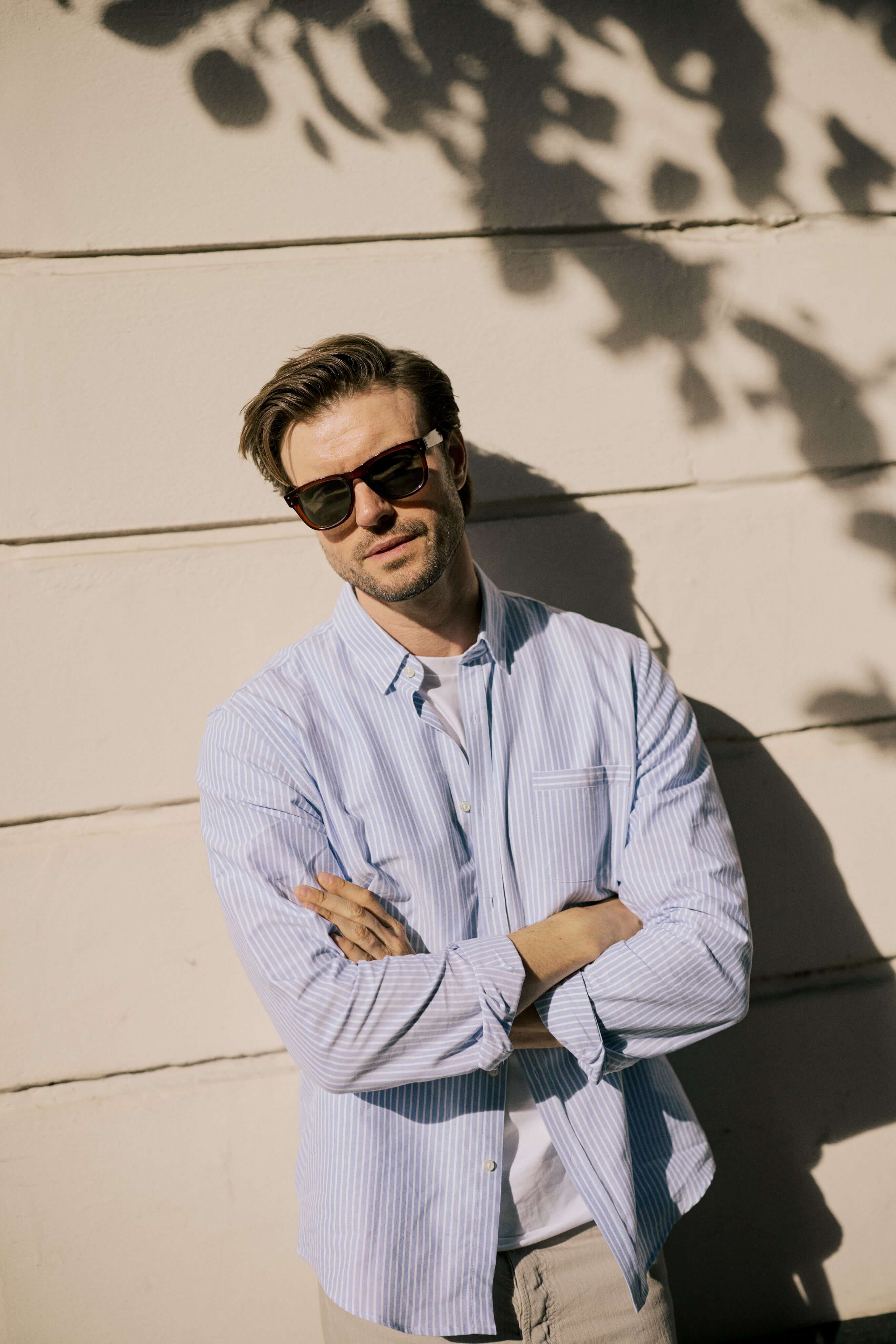 VARRO Keble Blue Stripe Oxford Shirt — Front view featuring hidden button-down collar and relaxed fit on a man standing outdoors.
