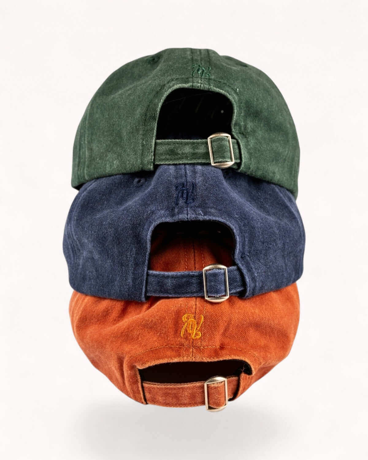 Stacked image showing Midnight Navy with Forest Green and Ember Orange caps