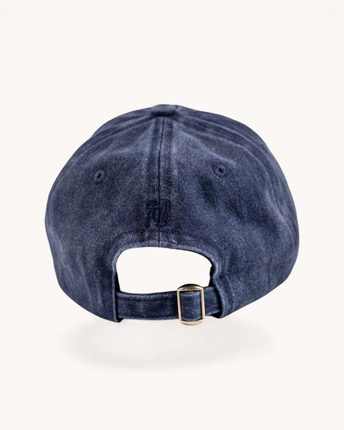 Back of Midnight Navy cap with adjustable strap and metal buckle