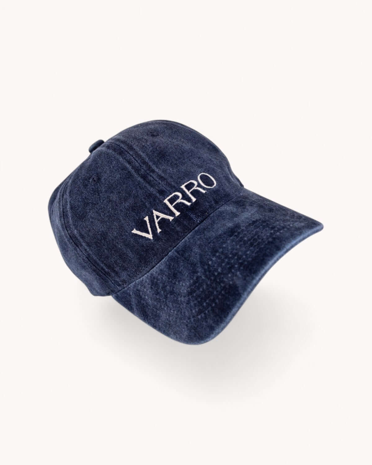 Front view of Midnight Navy VARRO cap showing embroidered logo