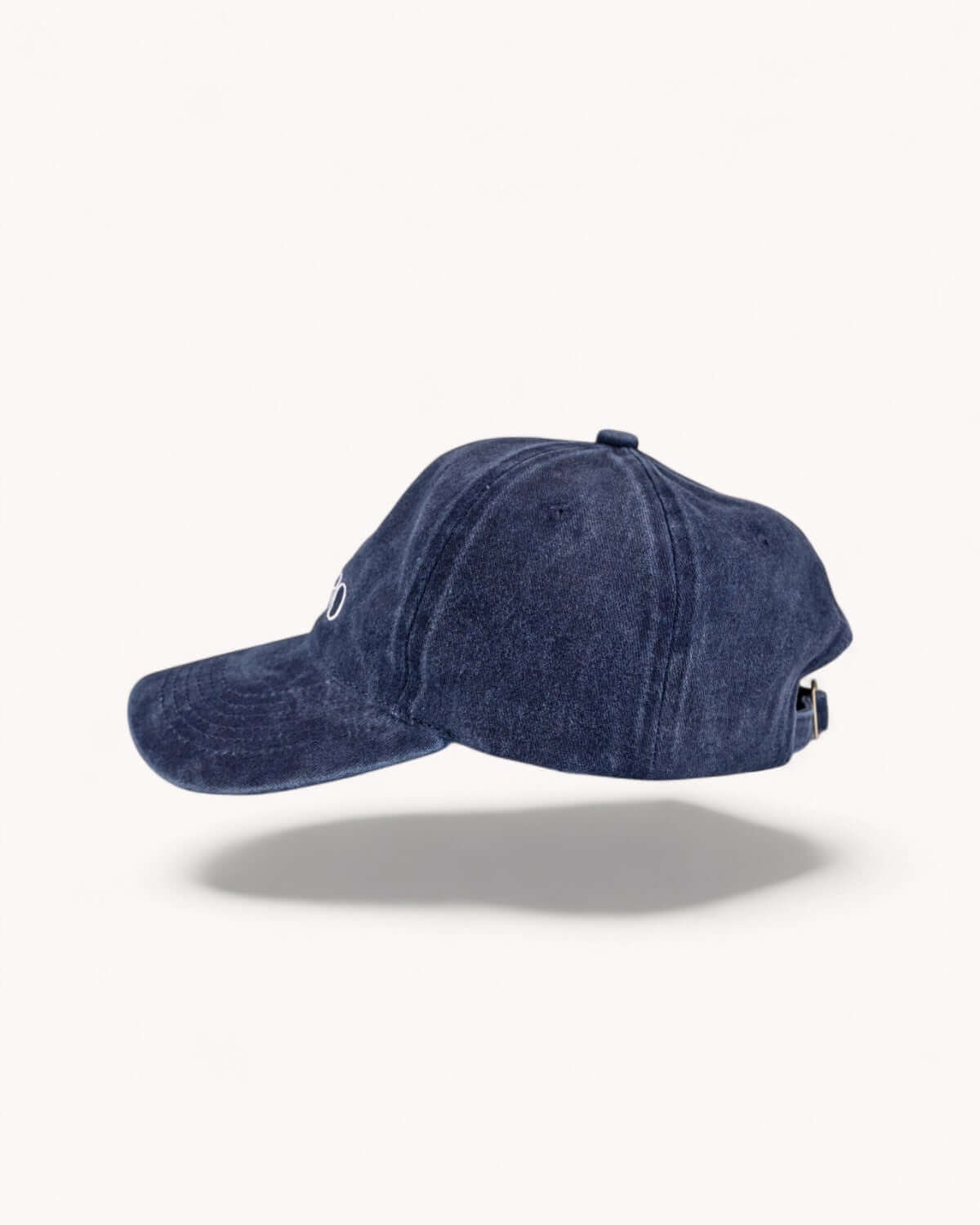 Left side profile of Midnight Navy vintage cap on white backdrop