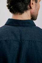 Back view of the VARRO Evelyn Midnight Navy shirt showcasing the hidden button-down collar and cuff details.