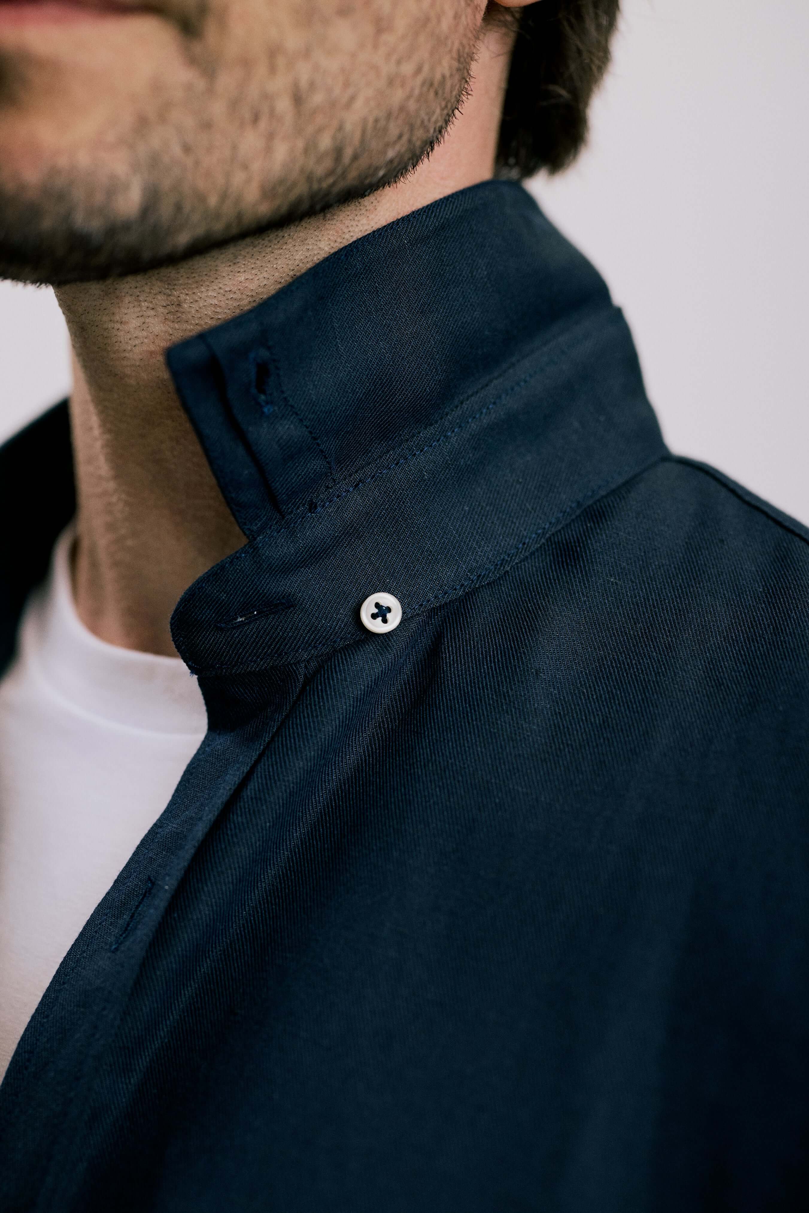 Close-up of the hidden button-down collar on the VARRO Evelyn Midnight Navy shirt in hemp cotton merino blend.