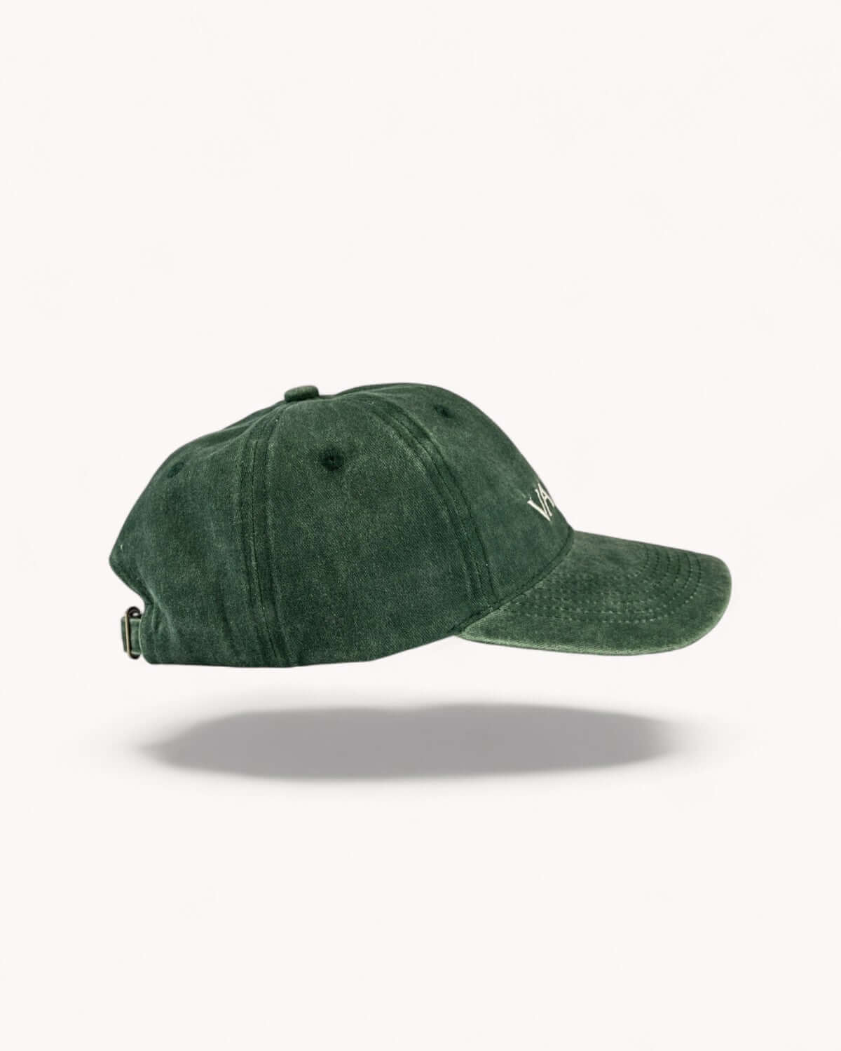 Side profile of Ember Orange cap showing washed fabric texture
